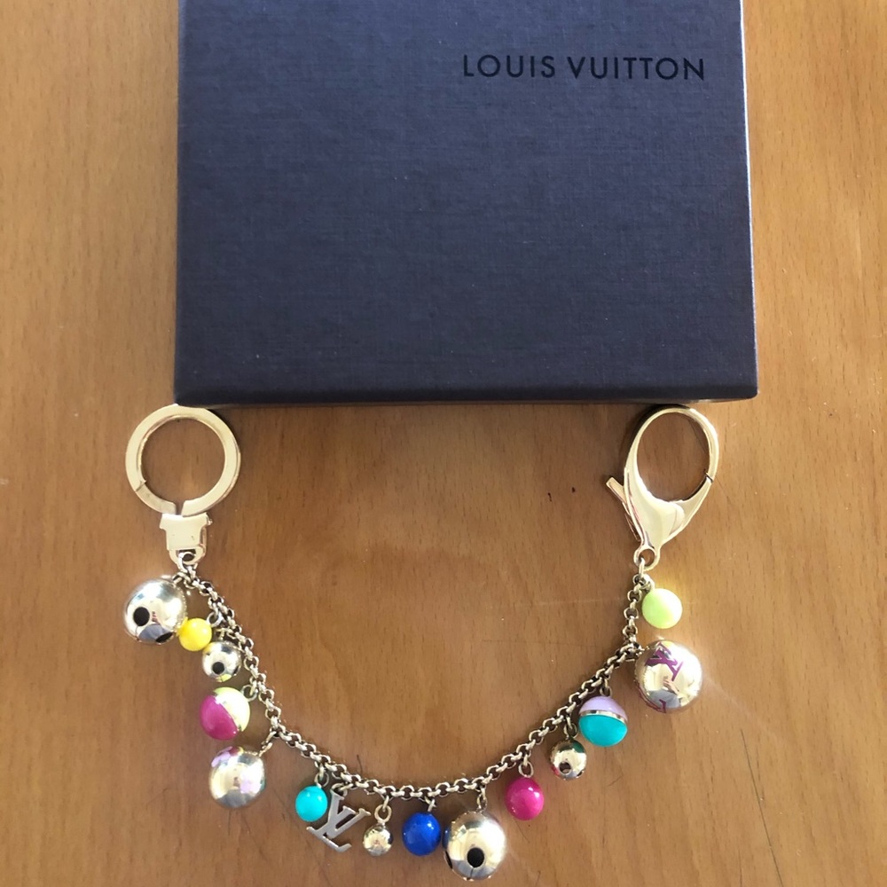 Louis Vuitton chain bag charm and key holder.